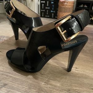 Great condition heals in Navy blue with gold buckle